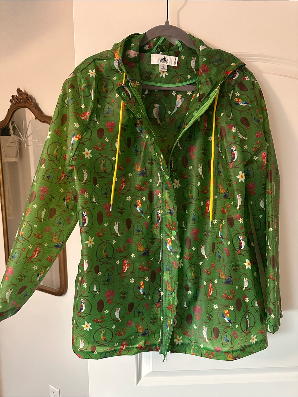 Disney rain jacket with tiki room print, size XL